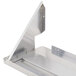 A stainless steel shelf for a Bakers Pride countertop charbroiler with a metal bracket.