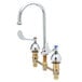 A chrome T&S deck mount medical faucet with 8-inch centers, gooseneck, and wrist action lever handles.
