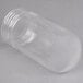 A clear plastic jar with a lid.