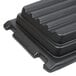 A black Rubbermaid hinged dome lid for tilt trucks.