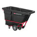 A black Rubbermaid Brute tilt truck with a red wheel.