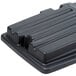 A black plastic Rubbermaid hinged dome lid for a tilt truck.