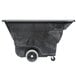 A black Rubbermaid tilt cart with wheels.