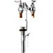 A white T&S deck-mount faucet with 4" wrist action handles.