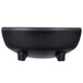 A black melamine molcajete ramekin with legs.