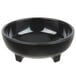 A close up of a black Carlisle molcajete ramekin.