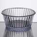 A clear Carlisle fluted plastic ramekin with a rim on top.