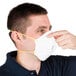 A man wearing a Cordova N-95 valved particulate respirator.