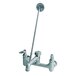 A close-up of a T&amp;S rough chrome mop sink faucet with a handle and vacuum breaker.