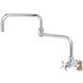 A T&S polished chrome wall mount faucet with a 4 arm handle.