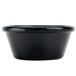A black Carlisle plastic ramekin.