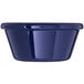 A close-up of a Carlisle cobalt blue plastic ramekin.