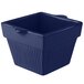 A blue square cast aluminum container with a lid.