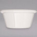 A Carlisle bone white plastic ramekin.