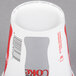A Solo white paper cold cup with a Coke label.