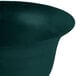 A hunter green cast aluminum tulip salad bowl with a black rim.