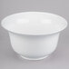 A white Tablecraft cast aluminum tulip bowl with a white rim.