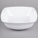 A white bowl with a curved edge.