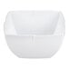 A white, square-shaped melamine serving bowl with a 1.5 quart capacity.