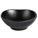 A black melamine bowl with a curved edge.