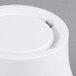 A close up of a white Carlisle melamine pedestal.