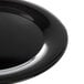 A close-up of a Carlisle black melamine round platter with a wide rim.