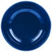 A cobalt blue cast aluminum bowl with a white interior.