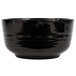 A black Tablecraft cast aluminum fruit bowl.