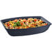 A Tablecraft black cast aluminum oblong salad bowl with pasta, vegetables, and cheese on a table.