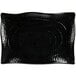 A black rectangular platter with scalloped edges and wavy lines.