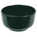 A hunter green cast aluminum fruit bowl with a handle.