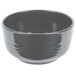 A gray Tablecraft cast aluminum fruit bowl with a handle.