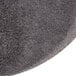A close up of a Scrubble black mesh sand screen disc.