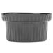 A natural cast aluminum Tablecraft souffle bowl with ridges.