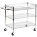 A Luxor white three shelf wire mail cart with wheels.