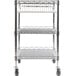 A white Luxor three shelf wire mail cart with wheels.