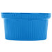 A sky blue cast aluminum souffle bowl with ridges on the surface.