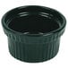 A hunter green cast aluminum souffle bowl with a ribbed rim.