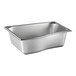 A Vollrath stainless steel Wild Pan with curved edges.
