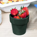 A Tablecraft hunter green and white speckled bowl filled with strawberries.