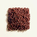 A pile of Adourne chocolate sprinkles on a white background.