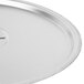 A stainless steel Vollrath pot lid on a pan.