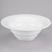 A Tablecraft white cast aluminum wide rim salad bowl.