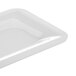 A close-up of a white Carlisle 1/3 size food pan.