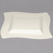 A white square Fineline plastic plate with a wavy edge.