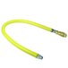 A yellow hose with a couple of metal fittings.