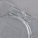 A close-up of a clear plastic Carlisle StorPlus food pan lid with a spoon notch.