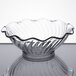 A clear glass Carlisle tulip berry dish with a rippled edge.