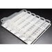 A white plastic tray with plastic tube holders.