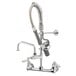 A chrome T&S wall mounted pre-rinse faucet with hose and club handles.